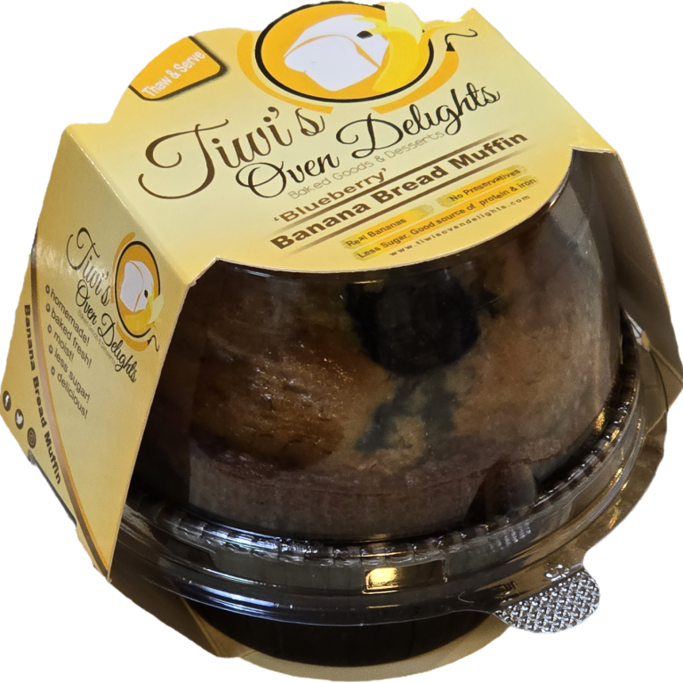 Blueberry Banana Bread Muffin in a clear plastic container with a yellow label reading "Tiwi's Oven Delights."